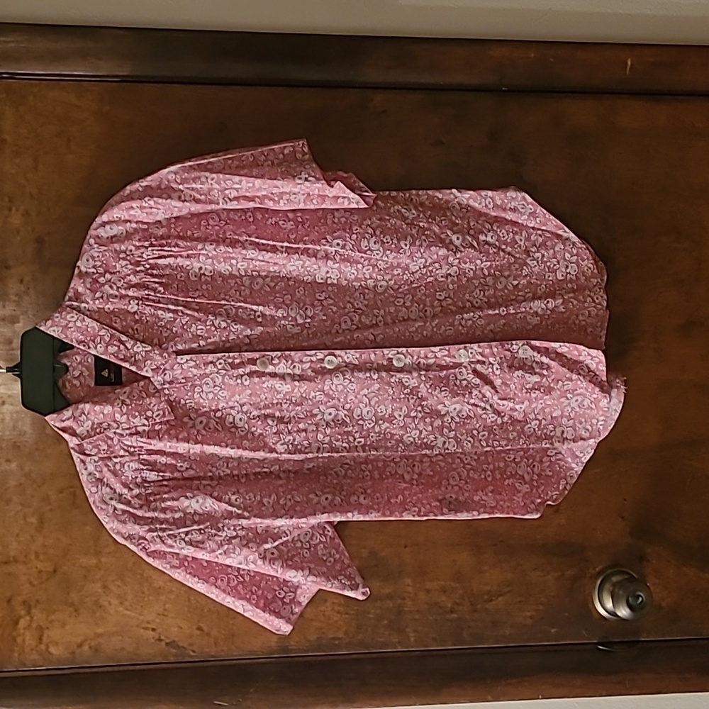 Bright pink floral short sleeved button-down blouse.